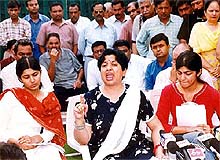 Madhu, wife of Inspector-General Ravi Kant Sharma, flanked by her two daughters