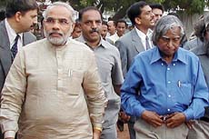 President A.P.J. Abdul Kalam walks with Gujarat Chief Minister Narendra Modi in Ahmedabad on Monday 