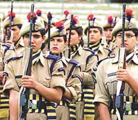 Lady police personnel hold their rifles during the general salute at the Independence Day celebrations in Srinagar on Thursday. 
