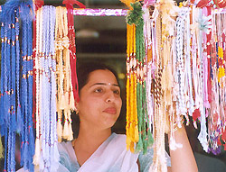 A sister selects a rakhi for her brother