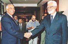 Foreign Minister Yashwant Sinha shakes hands with Pakistan Foreign Affairs Minister Inamul Haq after the opening ceremony of the ministerial meeting of SAARC in Kathmandu on Wednesday. 