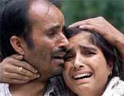 Unidentified relatives mourn the death of Independent candidate