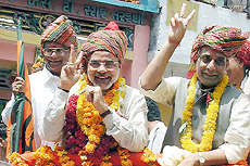 Gujarat Chief Minister Narendra Modi flanked by BJP General Secretary and Vice-President Rajnath Singh and Ramdas Agrawal