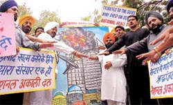Paramjeet Singh Pamma and activists of the National Akali Dal at the commemorative prayer meet, held to pay homage to those killed in the WTC attack