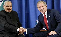 US President George W. Bush shakes hands with Atal Bihari Vajpayee