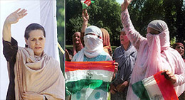 Congress President Sonia Gandhi waves to her masked supporters