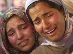 Relatives cry near the body of Maimoona Akhter
