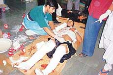 A victim receives treatment at the Civil Hospital in Gandhinagar