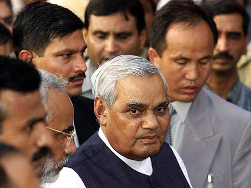 Prime Minister Atal Behari Vajpayee speaks to newsmen after a visit to the Akshardham temple