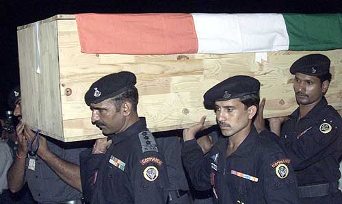 Troops carry a coffin
