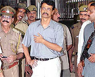 Mr R.K. Sharma being escorted to the Karkardooma courts