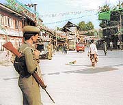 A paramilitary soldier stands guard in Pulwama 