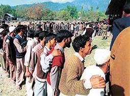 Despite the killing of National Conference candidate and Law Minister Mushtaq Ahmad Lone by militants, enthusiastic voters wait outside polling booths to cast their votes at Haihama in Lolab constituency of Kupwara district in north Kashmir 