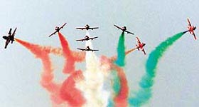 Suryakiran aircraft perform aerodynamics as part of the Air Force Day celebrations in New Delhi