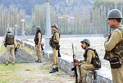 Paramilitary forces patrol near a counting centre on the banks of the Dal Lake in Srinagar on Wednesday.
