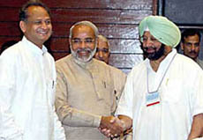 Rajasthan Chief Minister Ashok Gehlot, Gujarat Chief Minister Narendra Modi and Punjab Chief Minister Amarinder Singh at the Chief Ministers meeting on the fiscal situation of states 