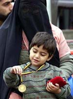 Faryal Imtiyaz plays with a medal