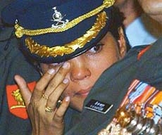 One of the recipients holds back her tears during the defence investiture ceremony at Rashtrapati Bhavan in New Delhi on Tuesday.