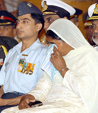 One of the recipients holds back her tears during the Defence Investiture Ceremony at Rashtrapati Bhavan in New Delhi on Saturday.