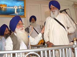 Re-elected SGPC President Kirpal Singh Badungar acknowledges congratulations from former SGPC chief Gurcharan Singh Tohra in Amritsar on Tuesday