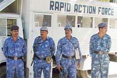 Para-military troopers of the Rapid Action Force guard a street in Godhra