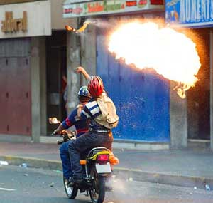 Protesters throw a Molotov cocktail at troops 