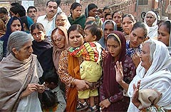 BJP leader Lakshmi Kanta Chawla listens to the problems of the families of Punjab Home Guards who have not been paid their salaries for the past five months