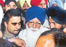 Former Punjab Agriculture Minister Gurdev Singh Badal being brought to the district courts 