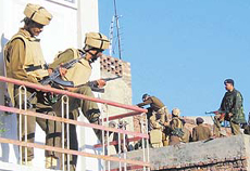 Securitymen take positions near a temple
