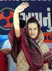 Congress President Sonia Gandhi waving to the crowd 