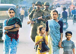 Paramilitary forces patrol a street of Ahmedabad 