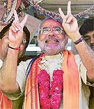 Caretaker Gujarat Chief Minister Narendra Modi makes the victory sign