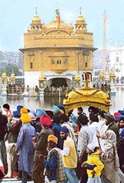 The palki carrying Guru Granth Sahib being taken out from Akal Takht for the Nagar Kirtan 