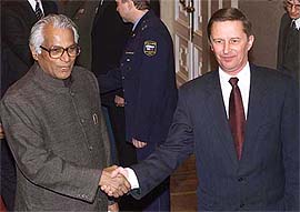 Defence Minister George Fernandes speaks to the press as he shakes hands with Russian Defence Minister Sergei Ivanov