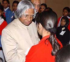 President A.P.J. Abdul Kalam with a girl student at a function in Kolkata on Tuesday