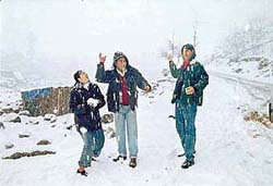 Tourists enjoy the seasons first snowfall 