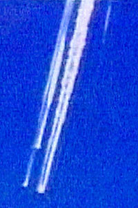 The Space Shuttle Columbia carrying its crew of seven streaks across the Dallas Texas skies