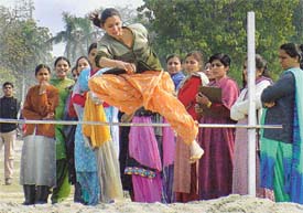 A participant in the high jump event at the annual athletics meet, Government College