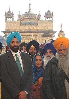 Minority Commission Chairman Tarlochan Singh and his wife comes out of the Golden Temple