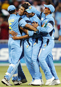 Rahul Dravid, Kaif and Yuvraj Singh celebrate with Ashish Nehra after he took the wicket of Englands Michael Vaughan