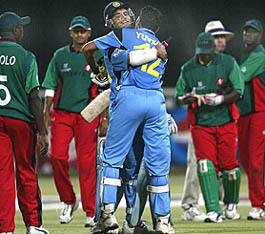 Indian captain Saurav Ganguly and team-mate Yuvraj Singh embrace after winning their first World Cup Super Six match against Kenya in Cape Town. India won by six wickets.