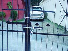 The main gate of the residence of the Chairman of the HP State Subordinate Selection Board at Hamirpur which was sealed by the Enforcement Department of Himachal police 