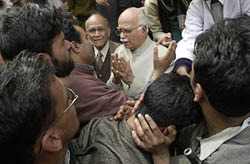 Deputy Prime Minister L. K. Advani talks to Kashmiri Pandits in Nadimarg, about 50 km south of Srinagar