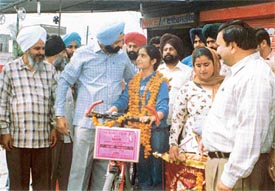 Supam Sandhu, a student of KVM School, starts off on a bicycle expedition