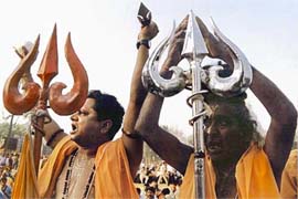 Sadhus shout while calling for the construction of the Ram Temple in Ayodhya on Monday