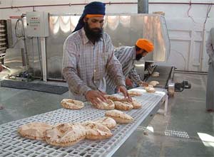 A view of the 'chapati' making machine, imported from Lebanon, at Guru Ram Dass 'langar hall' inside the Golden Temple