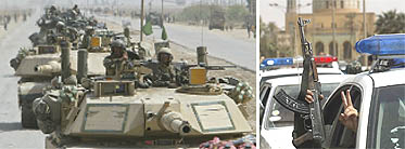 A convoy of US tanks passes through an Iraqi village