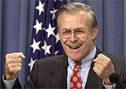US Secretary of Defence Donald Rumsfeld gestures triumphantly 