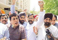 Transporters shout slogans at Transport Bhavan after meeting Minister of State for Transport B.C. Khanduri in New Delhi on Thursday.