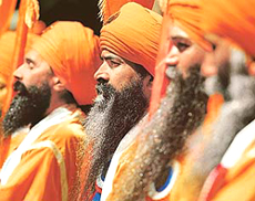 Sikh men march down Broadway during the annual Sikh Day parade in New York on Saturday.